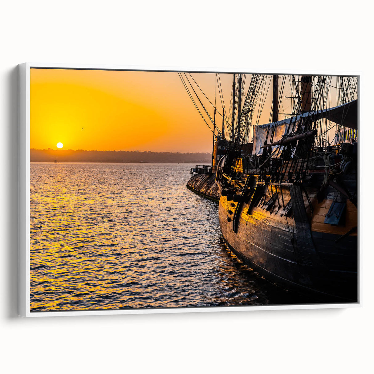 Framed canvas of a vintage black and white ship, ideal for bedroom wall art with a classic maritime theme.