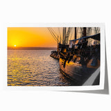 Large rolled print depicting a vintage ship on muted blue and gray sea, suitable as art wall dining room decor.