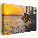 Large art print of a ship on calm waters, rendered in muted blue and gray tones on stretched canvas.