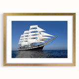 Extra large abstract art print of a stylized ship, featuring textured gold and blue tones on a framed canvas.
