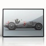 A large abstract wall art print featuring race cars in motion, using bold black and red colors on a framed acrylic.