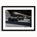 Abstract art print of race cars in vibrant, colorful strokes on a large black framed canvas, suited for living room decor.