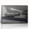 Large abstract wall art featuring a dynamic race car scene in vibrant red and blue tones on a black acrylic framed print.