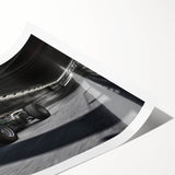 Extra large wall art featuring a dynamic car race scene on a rolled print, ideal for large living room decor.