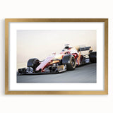 Extra large wall art featuring abstract depiction of race cars in vibrant colors on a gold-framed canvas.