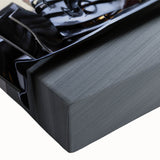 Large art depicting a close-up of race cars in motion, rendered in black and white on a stretched canvas.