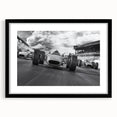 Extra large abstract art print of colorful race cars, textured style on a black framed canvas, ideal for living room decor.