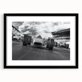 Extra large abstract art print of colorful race cars, textured style on a black framed canvas, ideal for living room decor.