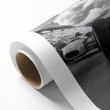 Art deco style race cars in bold red and blue on a rolled canvas, suitable as nursery wall art.