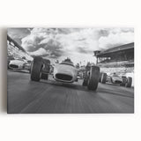 Black and white print of race cars in motion on stretched canvas, suited for kitchen wall art or bedroom ambiance.