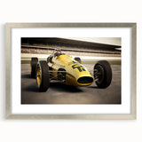 Textured art print of abstract race cars in dynamic hues of red and black on a silver-framed canvas.