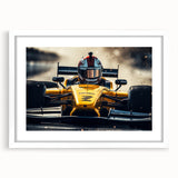 Abstract art print of race cars in motion, using bold red and blue tones on a white framed mat.