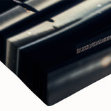 Black and white large art of race cars in motion on a stretched canvas, ideal for bedroom wall decor.