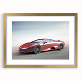 Abstract art print of sports cars in muted gold and black tones on a framed canvas.