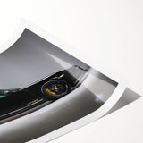 Extra large wall art of a sports car in bold red and black hues on a rolled print, suitable for large living room decor.