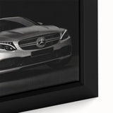 Framed canvas featuring a close-up of a black sports car with vibrant, textured color details.