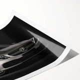 Extra large wall art featuring a line art design of sports cars, in black and white, on rolled canvas.