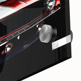 Mid-century modernist art featuring a close-up of sports cars in muted metallic tones on acrylic glass.