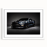 Abstract art print of a sports car in vivid red and black hues, framed with a white mat.