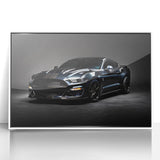 Art deco style poster of a white sports car on a framed acrylic, featuring bold black and white tones.