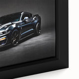 Framed canvas featuring a close-up of a black sports car with colorful, textured details.
