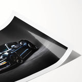 Extra large wall art of a sports car in vivid red and black hues on a rolled canvas, ideal for large living room decor.