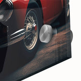 Large abstract wall art of a sports car in vibrant reds and oranges on acrylic glass, suitable for dining room ambiance.