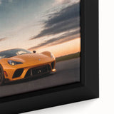Extra large framed canvas of a black sports car with colorful, textured background, suited for living room decor.