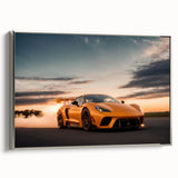 Side view of a vintage sports car in black and silver on a framed canvas.