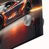 Large abstract wall art featuring a close-up of a sports car in vibrant red and black tones on acrylic glass.