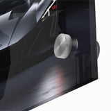 Large abstract wall art of a sports car in vibrant red and black tones on acrylic glass, suited for dining room ambiance.