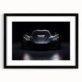 Abstract art print of colorful, textured sports cars on a large canvas, framed in black, ideal for living room decor.