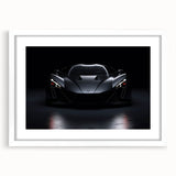 Abstract art print of a sports car in muted grays and reds on a white framed poster, suitable for dining room decor.
