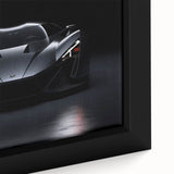 Framed canvas featuring a close-up of a black sports car with vibrant, textured color accents.