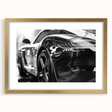 Extra large abstract art print featuring a textured depiction of sports cars, in gold frame, ideal for living room decor.