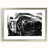 Abstract art print of a sports car in textured gray and silver tones on a framed canvas, suitable for bedroom decor.