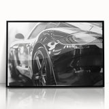 Large abstract wall art of a black sports car in mid-century modernist style, framed in acrylic.