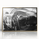 Front view of a golden sports car, rendered in mid-century modernist style on a framed acrylic.