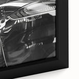 Extra large framed canvas of a black sports car with colorful, textured background, ideal for living room decor.