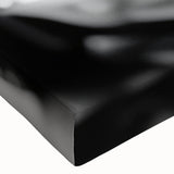 Large art of a black and white sports car, printed on stretched canvas, suitable for bedroom wall placement.