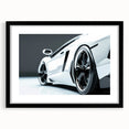 Abstract art print of colorful, textured sports cars, framed in black, ideal for living room decor.