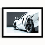 Abstract art print of colorful, textured sports cars, framed in black, ideal for living room decor.
