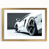 Extra large abstract art print featuring a textured depiction of sports cars in muted metallic tones, framed in gold.