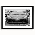 Abstract art print of a colorful, textured sports car on a large canvas, framed in black, suitable for living room decor.