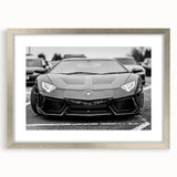 Textured art print of abstract racing cars in muted gray and silver tones on a framed poster, suitable for bedroom decor.