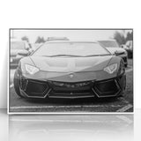 Front view of a white sports car in art deco style on a framed acrylic, featuring bold black and white tones.