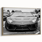 Side view of a vintage sports car in black and gold on a framed canvas, suitable as wall art for a bedroom.