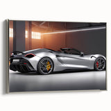 Side view of a vintage sports car in silver on a black framed canvas, ideal for decorating a modern office.