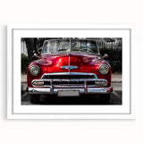 Abstract art print of vintage cars in muted earth tones on a framed white mat, ideal for dining room decor.