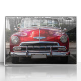 Art deco poster of a vintage car in black and white, framed in white acrylic.